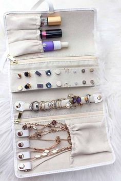 a white bag filled with lots of jewelry