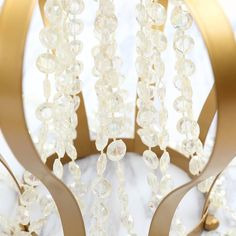 a chandelier with glass beads hanging from it's sides