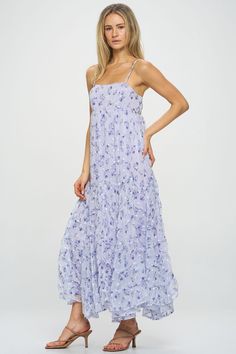 A gorgeous ditsy floral pattern flows throughout this whimsical asymmetric tiered maxi dress. Embroidery detail and unique seaming give a luxe, feminine feel to this warm-weather style. Pair with slide sandals or block heels to elevate the look. Product Details Material: 100% Polyester. Fit: True to size. Body length: 52" from shoulder to hem (size Small). Fabric: Lightweight chiffon.Features: Adjustable spaghetti straps, asymmetric tiers, raised hemlines, embroidered white flowers, fully lined. Feminine Midi Length Tiered Summer Dress, Chic Floral Embroidery Maxi Dress For Spring, Chic Ditsy Floral Print Maxi Dress For Spring, Flowy Casual Maxi Dress With Floral Embroidery, Chic Floral Embroidered Maxi Dress For Spring, Casual Floral Embroidered Maxi Dress For Brunch, Casual Maxi Dress With Floral Embroidery For Brunch, Flowy Tiered Dress For Garden Party In Spring, Tiered Spring Dress With Layered Hem