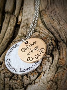 "Personalized hand stamped adoption necklace. Adoption day gifts. Gift for daughter. New mom gifts. Gotcha day jewelry. Blended family gifts. Adopt necklace. Foster child gifts. Adopted daughter gifts. Mothers day gifts. Adoptee gifts. Hand stamped and made to order. Made from a 3/4\" bronze disc, stamped with the phrase, \"Gotcha day,\" with a small heart stamp and the date of your choice. Underneath is a 1\" aluminum disc, stamped with the words, \"Wanted. Chosen. Loved. Adopted.\" Attached to Personalized Inspirational Jewelry For Birthdays, Personalized Inspirational Jewelry For Birthday, Inspirational Personalized Jewelry For Birthday, Personalized Charm Necklace For Mother's Day Anniversary, Personalized Hand Stamped Charm Necklaces, Mother's Day Stamped Charm Necklace As Personalized Gift, Hand Stamped Necklace For Father's Day Gift, Meaningful Hand Stamped Charm Necklace For Mother's Day, Meaningful Hand Stamped Charm Necklaces For Mother's Day