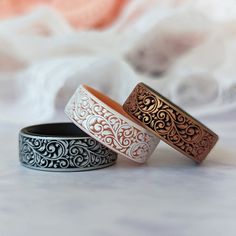 three different colored rings sitting on top of each other