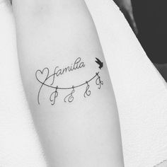 a tattoo with the word janita and a bird on it's left arm