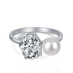 a diamond and pearl ring on a white background with a single pearl in the middle