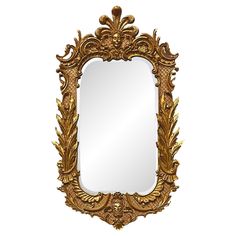 an ornate gold framed mirror on a white background