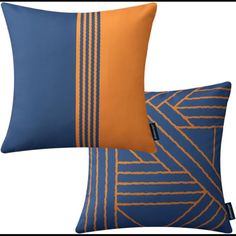 two blue and orange pillows sitting next to each other