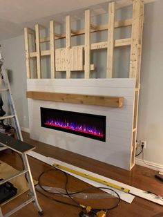 an electric fireplace being installed in a living room