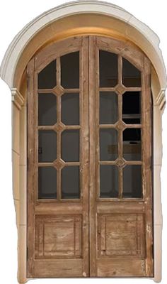 an arched wooden door with glass panels