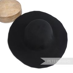 This black wool felt capeline hat body is made from 100% thick wool and has been stiffened to help in the hat blocking process. Great for making fascinators and hats from scratch the traditional way. Capeline Measures approx.: 2.5-3mm thick Flat measurement 28x46.5cm (11x18.3 inches) Weight: 120g Brim width from side crown to brim edge: 10cm (3.9 inches) Stiffener: 1 degree shellac stiffener. *Please note that this is not a finished hat but the 'body' to make one from scratch.* Petershams Guide Making Fascinators, How To Make Fascinators, Sinamay Fabric, Millinery Supplies, Hat Base, Large Hats, Velvet Flowers, Thick Wool, Feather Flower