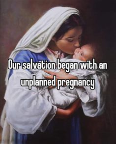 a woman holding a baby in her arms with the caption our salvation begun with an up