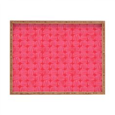 a wooden tray with pink and red designs on it's sides, in front of a white background