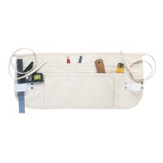 a white canvas bag with tools in it