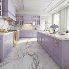 a large kitchen with marble counter tops and purple cabinetry, along with gold accents