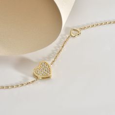 Celebrate the bond of love and friendship with our stunning 14K Solid Gold Heart Bracelet. Crafted with precision and elegance, this bracelet features a delicate heart design, symbolizing affection and connection. Made from high-quality 14K solid gold, it's a timeless piece of jewelry that radiates beauty and sentiment. Perfect for gifting to a friend or loved one, this bracelet is a meaningful expression of love and appreciation. Whether it's for Mother's Day or any special occasion, this uniqu Luxury Heart Bracelet As A Gift, Luxury Sterling Silver Heart Bracelet For Anniversary, Luxury Sterling Silver Bracelets For Valentine's Day, Luxury White Gold Heart Bracelet, Gold Cubic Zirconia Heart Bracelet For Valentine's Day, White Gold Heart Diamond Bracelet For Valentine's Day, Heart-shaped White Gold Diamond Bracelet For Valentine's Day, Yellow Gold Sterling Silver Heart Bracelet For Anniversary, Luxury White Gold Bracelets For Valentine's Day