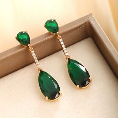 These earrings blend elegance with creativity, embodying a sophisticated, sweet fragrance style. The fashion-forward fringe design is perfect for various occasions. Plated with 18K gold and adorned with emerald-colored accents, they add a luxurious touch. Crafted from high-quality alloy and meticulously gold-plated, they ensure durability and a radiant finish, making them a standout piece in any jewelry collection. Item ID：X000753282 Product Color：Plated 18K gold--emerald Material：Alloy gold plating (All dimensions are measured manually maybe with deviation. Please take the real object as the standard) Emerald Drop Earrings, Emerald Earrings Drop, Sweet Fragrance, Earrings Emerald, Fringe Fashion, Drop Earrings Gold, Earring Gift, Sweet Fragrances, Drop Earring