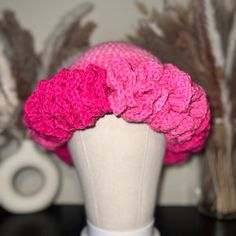 **HANDMADE TO ORDER** (PLEASE KEEP IN MIND THIS PRODUCT IS HANDMADE AND TAKES 2-3 DAYS TO CREATE)  Introducing our Pink Petal Ombre Ruffled Crochet Hat, a delightful blend of warmth and style. Handcrafted with meticulous attention to detail, this hat boasts a captivating ombre effect that transitions gracefully from soft blush tones to vibrant pinks. The gentle ruffles add a whimsical touch, evoking a sense of charm and femininity that's perfect for any occasion. Crafted with love and care, this Hand Knitted Adjustable Mini Hats For Spring, Adjustable Hand Knitted Mini Hats For Spring, Adjustable Hand-knitted Mini Hats For Spring, Spring Pink Yarn Crochet Hat, Pink Spring Crochet Hat, Pink Yarn Crochet Hat For Spring, Pink Hand Knitted Mini Hat, Adjustable Crochet Mini Hat, Handmade Pink Yarn Mini Hats