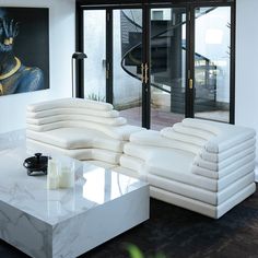 Dimensions: Piece: 28 H x 61 W x 36 D Set Wide Arrangement: 28 H x 122 W x 36 D Set Narrow Arrangement: 28 H x 72 W x 61 D Weight: 220 lbs / piece Materials: Supple Vegan Leather, Layered Foam Color Options: Cream-White Vegan Leather This unique sofa is sure to be a conversation starter in any space. The design is inspired by Ubald Klug's eclectic design, and it features an eye-catching layered look that resembles a topographic map. Crafted from supportive foam and upholstered in an easy to care Blue Ottoman, Unique Sofa, Modular Tile, Living Space Decor, Unique Sofas, Eclectic Furniture, Modern Sofa Sectional, Mid Century Sofa, Black Floor Lamp