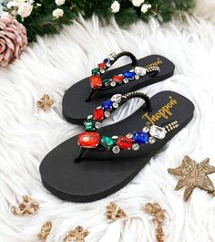 Description The beautiful rhinestone and customizable Flip Flops for the beach brides, bridesmaids, vacation, honeymoon or any occasion you desire to look gorgeous. Perfect in any outfit! Being unique and stunning on design, these flip flops must be your must-have item! The sandal is anti-slip, comfortable and durable as it is made from high quality rubber from the South of Thailand, where is famous for the best rubber tree. Moreover, the crystals are decorated on the sandal with effective adhesive glue and knitting threads by hand stitching. Don't worry when you walk on the beach or use it in the rainy season. For anyone who loves a real handmade product, don't miss it out! Product Description: - Thailand High-Quality Rubber Sole - Luxury Crystals/Rhinestones  - High-quality PU gold threa Black Rhinestone Flip Flops For Beach, Open Toe Embellished Flip Flops For Party, Party Flip Flops With Toe Post For Beach Season, Party Toe Post Flip Flops For Beach Season, Toe Post Flip Flops For Beach Season Party, Bling Flip Flops, Beach Wedding Sandals, Bling Design, Sandals Beach