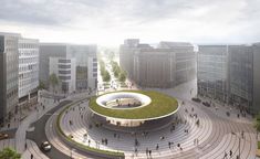 an aerial view of a circular building with a green roof on the top and people walking around