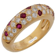 This classic authentic Cartier ring is crafted in 18k yellow gold and pave-set with brilliant-cut round E-F-G VVS1-VVS2 diamonds and round red rubies. Made in France circa 1994. Measurements: 0.23" (6mm) width. The ring size is 6.25 - EU 53. Resizable. Sizing fees will be provided upon request. Excellent condition. Comes with original box without paperwork. Luxury Round Ruby Ring With Diamond Accents, Luxury Ruby Ring With Diamond Accents And Round Shape, Classic Cartier Diamond Ring With Pave Setting, Cartier Round Brilliant Cut Diamond Ring, Luxury Ruby And Diamond Ring In Yellow Gold, Luxury Ruby Ring With Diamond In Yellow Gold, Ruby Ring With Diamond Pavé Setting, Ruby Ring With Pave Setting And Diamond, Formal Yellow Gold Ruby Ring With Pave Setting