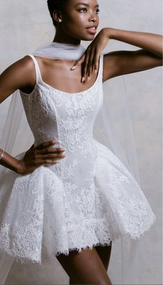 a woman wearing a white dress and veil