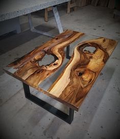 two pieces of wood sitting on top of a table