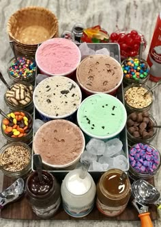 an assortment of desserts and confections are arranged on a tray with ice cream