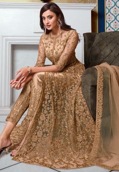 Net Abaya Style Front Slitted Kameez in Beige This Semi-stitched Attire with Satin Lining is Enhanced with Dori, Zari and Sequins Work. Crafted in Round Neck and Quarter Sleeves Available with a Satin Pant in Beige and a Net Dupatta in Beige The Kameez and Bottom Lengths are 52 and 38 inches respectively Do note: Accessories shown in the image are for presentation purpose only and length may vary upto 2 inches.(Slight variation in actual color vs. image is possible). Brown Anarkali, Mens Festival Wear, Work Abaya, Indowestern Lehenga, Bridal Anarkali Suits, Different Sleeves Style, Peach Lehenga, Satin Pant, Dori Work