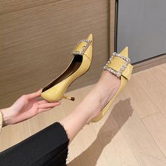 These eye-catching yellow kitten heels are perfect for adding a touch of fun and personality to any outfit. The pointed toe and rhinestone detailing give them a sophisticated edge. while the patent leather ensures they remain on trend. Whether you're dressing up for a special occasion or simply adding a pop of color to your everyday look. these shoes are sure to make an impact. Upper: Patent Leather Lining: Leather Outsole: TPR Toe: Pointed Toe Closure: Slip on Heel: 7cm/2.5'' Color: Black. Yell Trendy Yellow Low Heels, Chic Patent Leather Kitten Heels For Party, Yellow Patent Leather Heels For Evening, Yellow Patent Leather Party Heels, Yellow Almond Toe Heels For Party, Yellow Heels With Rhinestones For Party, Yellow Rhinestone Heels For Party, Party Yellow Heels With Rhinestones, Yellow Rhinestone Party Heels