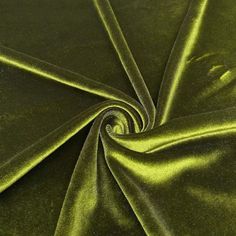 a close up shot of a green velvet fabric