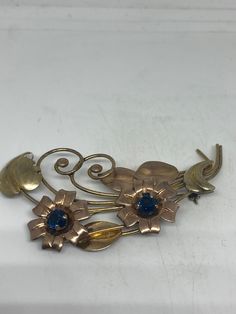 Vintage Flower Gold filled Brooch Pin Vintage Unusually crafted Set with blue Crystal Over an inch All jewelry is shipped free in the US in a nice gift box. Check out our over a THOUSAND great reviews Engraving is $4 per letter and is not always perfect depending on the piece. It can take a few days if the jeweler is busy. This is payable to Paypal Judithsltd@gmail.com Blue Flower-shaped Jewelry Brooch, Blue Floral Brooch Jewelry, Flower Shaped Brooch Jewelry As Gift, Flower Shaped Costume Jewelry Brooch, Craft Set, Heart Locket, Vintage Jewellery, Blue Crystals, Gold Details