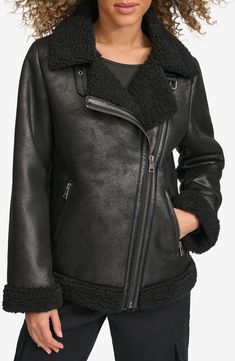 Luxuriously plush faux shearling softens the biker-inspired edge of this faux-leather moto jacket refreshed in a longer, boxier silhouette. Asymmetric zip closure Notched collar Front zip pockets Faux-shearling lining, with 100% polyester fill 100% polyester with polyurethane coating; 100% polyester faux shearling Machine wash, tumble dry Made in China Fur Collar Jacket Outfit, Collar Jacket Outfit, Luxury Jacket, Faux Suede Fabric, Winter Outerwear, Faux Suede Jacket, Aviator Jackets, Faux Leather Moto Jacket, Oversized Style