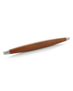 a wooden pen sitting on top of a white surface