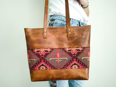 "Personalized Bohemian Tote Bag,  Limited Edition Leather Bag, Kilim texture, Bohemian Laptop bag, Gift Product details: -Metarials:  High quality Top Grain Crazy Horse Leather  Kilim fabric  YKK zipper -Dimensions:   Width top: 15.3 inches (39 cm) Width Bottom: 12.2 inches (31 cm) Height: 11.2 inches (30 cm) Depth: 4 inches (10.5 cm) This handmade women tote bag is produced by crazy horse leather. It has one pocket inside. The bag has a YKK Zipper. Simple, reliable, and durable. 13\" laptops ca Bohemian Shoulder Bag With Leather Lining For Travel, Bohemian Bags With Leather Lining For Daily Use, Bohemian Leather Tote Satchel, Bohemian Tote Shoulder Bag With Leather Lining, Bohemian Leather Bag With Leather Backing, Bohemian Leather Shoulder Bag With Leather Handles, Bohemian Leather Shoulder Bag For Daily Use, Leather Bohemian Shoulder Bag, Bohemian Rectangular Soft Leather Bag