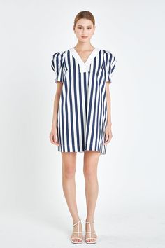 Introducing our must-have V-neck Puffy Sleeves Dress! This stunning dress features bold stripes and a striking contrast V neckline for a modern twist on the classic look. The puffed mid-length sleeves add a touch of femininity, while the relaxed fit ensures all-day comfort. Perfect for both casual and dressy occasions, this versatile dress is a wardrobe essential. Elevate your style game and stand out from the crowd with this trendy dress. Get ready to turn heads and make a statement with our V-neck Puffy Sleeves Dress. Shop now and be the envy of all! Striped Contrast V neckline Puffed mid-length sleeves Relaxed fit Mini length Lining Hand wash cold Do not bleach Do not tumble dry Iron low Shell: 97% Cotton 3% Spandex Contrast: 100% Cotton Lining: 100% Cotton SS329D Total length: 35" Bust Puffy Sleeves Dress, Ivy Clothing, Summer Style Guide, Casual Party Dresses, Casual Day Dresses, Maxi Dress Sale, Mid Length Sleeves, Trendy Dress, Comfy Dresses