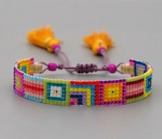 a multicolored bracelet with beads and tassels