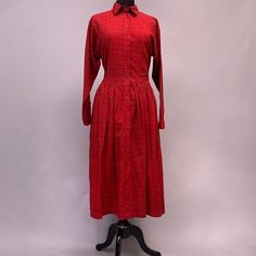 This is such a great dress. Made by the high street brand Monsoon back in the 1980s. It is fantastic quality. Thick cotton with a very interesting pattern woven, not printed on the fabric. buttons up hem to collar. flairs out from the waist. 2 hidden pockets on each side and hem is below the knee. Designed in England made in India. this dress will look so good with doctor martens or other lace up boots, pair with a cable knit cardi and you have your new winter look. Label says says uk 14 but thi Cotton Midi Dress With Button Closure, Cotton Midi Dress With Buttons For Daywear, Cotton Midi Dress With Button Closure For Daywear, Retro Cotton Vintage Dress For Daywear, Retro Cotton Plaid Dress, Retro Plaid Cotton Dress, Vintage Cotton Midi Dress For Fall, Classic Cotton Shirt Dress For Fall, Fitted Cotton Vintage Dress For Fall