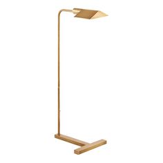 a brass colored floor lamp with a wooden base and an arrow shaped light on top