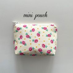 "I made this mini zipper pouch with a flat bottom so that it's roomy and can hold a lot of little items.  Great for: chargers, AirPods, earbuds, chapstick, makeup, money, crystals, essential oils and more.  It's small enough to fit in your purse or bag without taking up too much room and can stand on it's own.   It measures approximately 5.5\" length at the top; 4.5\" length at the base, 4\" high and 1.75\" flat bottom and has top zipper closure.  Made with Tula Pink cotton fabric, layers of stabilizers and YKK zipper.   Items in picture not included. Spot clean recommended.   Ready to ship." Compact Pink Pouch For Everyday Use, Compact Pink Pouch For Personal Use, Pink Compact Pouch, Portable Pink Pouch For On-the-go, Standing Pouch, Mini Zipper Pouch, Pink Pouch With Zipper Pocket For On-the-go, Pink Cotton Fabric, Tula Pink