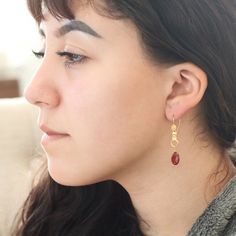 "Gorgeous hand crafted solid 18K Gold earrings by NewWorldGems! These one of a kind beauties are just over 1.75\" in length. Andesine was first described in 1841 for an occurrence in the Marmato mine,in Columbia and has only recently been used for beads. The stunning cherry red coloring is 100% natural! This stone is a member of the Labradorite/Feldspar family of gemstones." Single Briolette Earring In Yellow Gold, Yellow Gold Briolette Single Earring, Gold Briolette Earrings, Handmade Briolette Yellow Gold Earrings, Handmade Yellow Gold Briolette Earrings, 14k Gold Teardrop Linear Single Earring, 14k Gold Briolette Earrings, Gold Briolette Single Earring, Single Drop Earring In 14k Gold