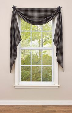 a window with a black and white checkered curtain