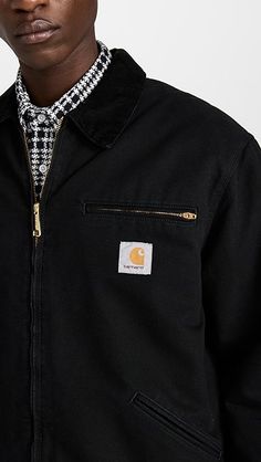 Winter Workwear Outerwear With Logo Patch, Black Outerwear With Logo Patch For Work, Casual Workwear Outerwear With Logo Patch, Cotton Outerwear With Logo Patch For Work, Black Utility Jacket With Patch Pockets For Outdoor, Black Outdoor Outerwear With Patch Pockets, Black Cotton Utility Outerwear, Black Cotton Utility Jacket For Work, Black Utility Jacket With Patch Pockets For Streetwear