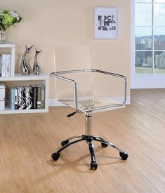 a clear office chair sitting on top of a hard wood floor