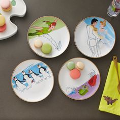 four plates with cartoon characters on them