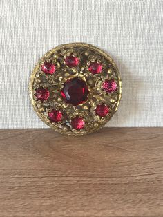 Beautiful Czech brass filigree brooch with red cut glass stone centre and 8 red pointed faceted glass detail stones 1930s/40s Approx size 5 cm diameter In used condition wear and tear commensurate with age and use see photos for overall condition xx Vintage Red Brooches For Party, Red Retro Brooch Jewelry, Retro Red Brooch Jewelry, Antique Red Brooch For Formal Occasions, Elegant Red Brooches Collectible, Antique Red Brooch As Gift, Antique Red Brooches As Gift, Antique Red Brooches For Gift, Antique Red Brooches As A Gift