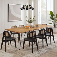 a dining room table with chairs around it