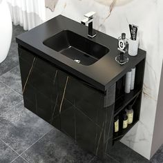 a bathroom sink sitting under a mirror next to a white toilet and black counter top