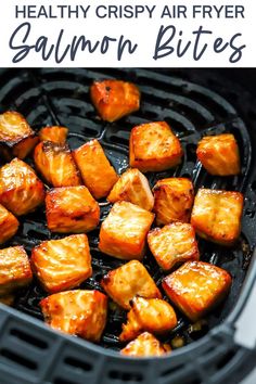 the air fryer is full of cooked food and has text overlay that reads healthy crispy air fryer salmon bites