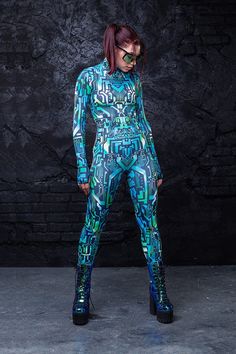 For all the babes with sparks in their eyes and voltage running through their veins. Electrify the dance floor with our Short Circuit Costume. This piece is made from a high quality stretchy and breathable Lycra fabric, that feels wonderful on the skin. It’s printed with outstanding graphics that react to UV light, so you can literally glow. The design features long sleeves with thumbholes, a mock neckline and a body con fit. Rock it on Halloween Eve or ur next festival of choice. U won’t go unn Blue Cyberpunk, Cyberpunk Costume, Futuristic Costume, Full Bodysuit, Rave Bodysuit, Festival Outfits Women, Cyberpunk Clothes, Rave Costumes, Burning Man Outfits