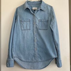 Women’s Denim Button Up, Size Small. Shirt Has A High-Low Style Where The Back Is A Little Longer Than The Front. Washed Once, But Never Worn. Perfect Condition. Light Wash Chambray Button-up Denim Top, Light Wash Chambray Denim Top With Button Closure, Light Blue Button-up Denim Top, Denim Button-up Shirt For Day Out, Light Indigo Casual Button-up Denim Top, Casual Light Indigo Button-up Denim Top, Light Wash Button-up Denim Top, Light Wash Denim Top With Button Closure, Casual Light Wash Denim Top With Button Closure