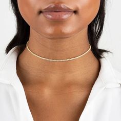 Tennis necklaces are a classic must have and the Talia Crystal Choker gives you a whole vibe with it's choker style. Its perfect for wearing alone or layered with other necklaces. This is a fall staple! This necklace is made of stainless steel, so waterproof. The color remains perfect! Gold: 18k gold platingLength: 42 - 48 cmMaterial: Stainless steel Waterproof jewelry Hypoallergenic Tarnish Free Glazd Pouch with every order Free US Shipping Easy Exchange & Return policy PRODUCT INFOAll our jewe Adjustable Yellow Gold Choker Jewelry, Adjustable Yellow Gold Choker, Adjustable Elegant Choker Chain Necklace, Elegant Adjustable Choker Chain Necklace, Elegant Gold Tennis Necklace Choker, Trendy Yellow Gold Choker, Fine Jewelry Tennis Necklace For Everyday, Everyday Fine Jewelry Tennis Necklace, Everyday Fine Tennis Necklace